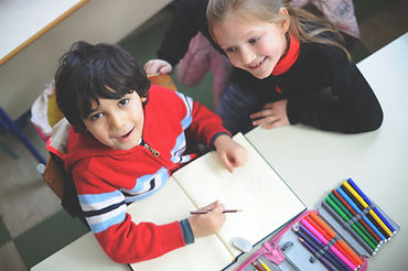 Children learning together at a table